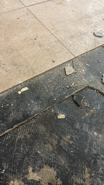 Black bitumen mastic floor removal in a W14 flat